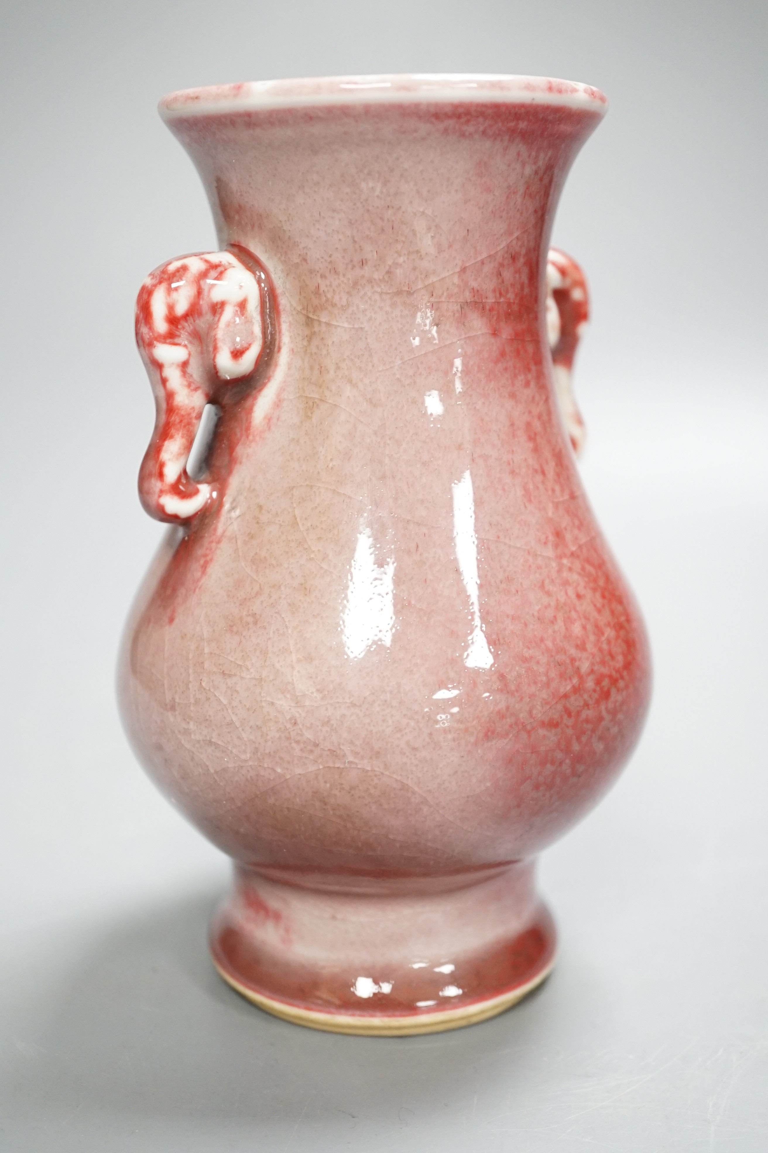 A Chinese Sang de boeuf elephant handled vase 15.5cm